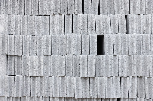 Numerous gray concrete bricks stacked together. to wait for use before building the wall used for construction General building walls Material that is strong, can withstand pressure and heat well.
