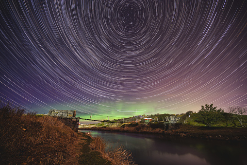 Aurora and star trails at the coast of Stavanger, Norway