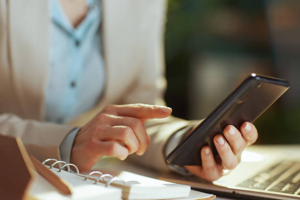 istock Modern woman worker in green office using phone 1499824532