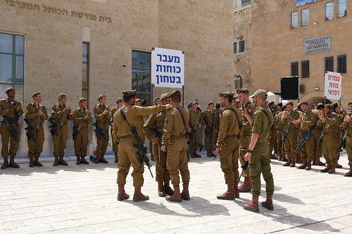 Jerusalem, Israel - May 2023 : Jewish soldiers on military oath. The Israeli Army. Young fighters with machine guns.
