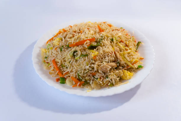 istock Chicken fried rice - egg fried rice with spices on white background 1499826550