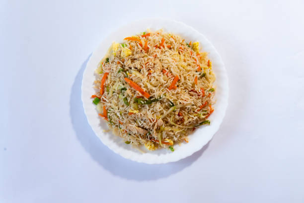 istock Chicken fried rice - egg fried rice with spices on white background top view 1499826560