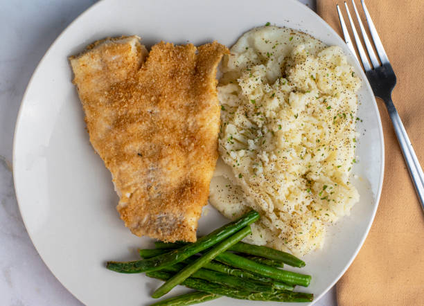 istock baked haddock served with  mashed  potatoes and green beans 1499828435
