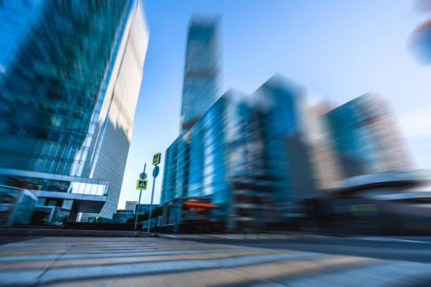 Crosswalk at modern business district with blurred motion effect