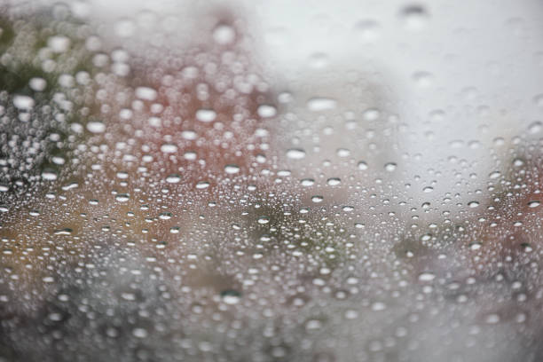 istock Raindrops gracefully dance on a window pane, reflecting a moody rainy day. Symbolizing introspection, renewal, and nature's serene beauty 1499836926