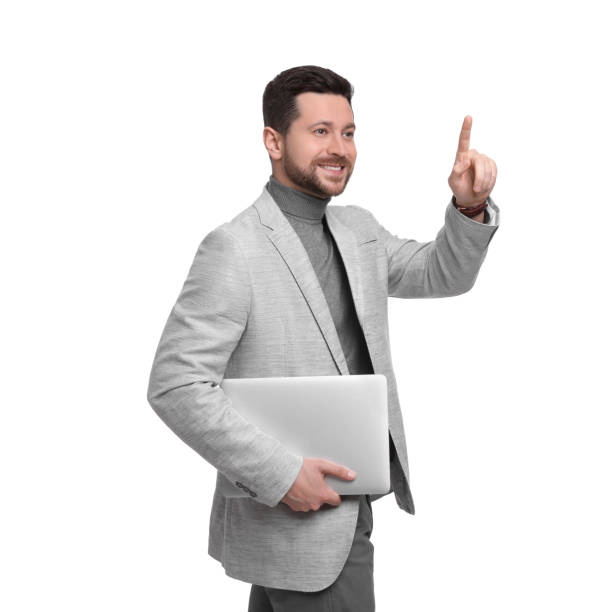 istock Handsome bearded businessman with tablet pointing at something on white background 1499840431
