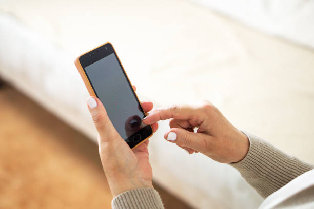 istock Close up of hands from a woman using her mobile phone. 1499842809