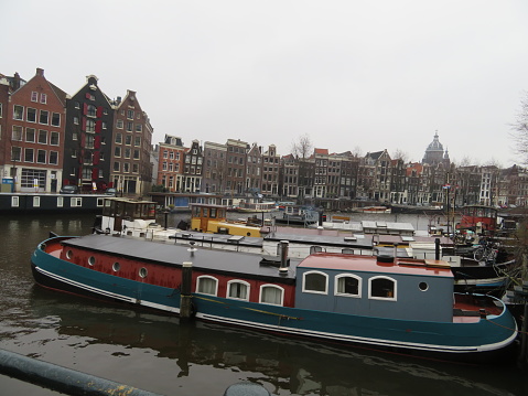 The Yachts And Pier Of Amstel River In Amsterdam, The Netherlands