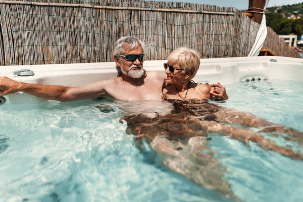 istock senior couple have fun in a body massage pool 1499846545