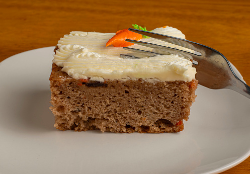 carrot cakeserved on a plate with a fork