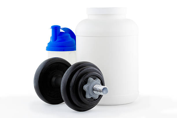 Dietary Supplement with Dumbell stock photo