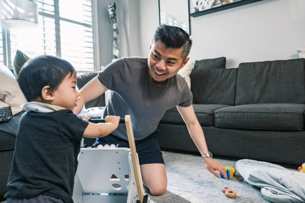 istock Young Korean Father at Home playing with toddler son 1499852391