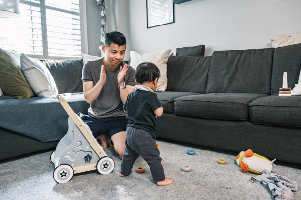 istock Young Korean Father at Home playing with toddler son 1499852395