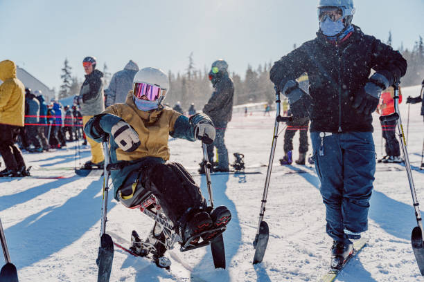 istock Two adaptive athletes enjoying a day on the mountain together 1499856849