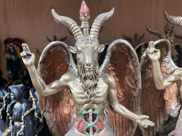 Statue of Baphomet, frequently identified as a demon or satan, and a symbol of Satanism Baphomet, a controversial symbol deeply intertwined with the realm of esotericism and Satanism, embodies a dark and unsettling aspect of human fascination. Depicted as a grotesque amalgamation of a human body and a goat's head, it serves as a provocative representation of rebellion against societal norms and established religious institutions. While some may argue that Baphomet symbolizes personal empowerment and freedom, its association with Satanism raises concerns about the glorification of destructive and malevolent forces. satan goat stock pictures, royalty-free photos & images