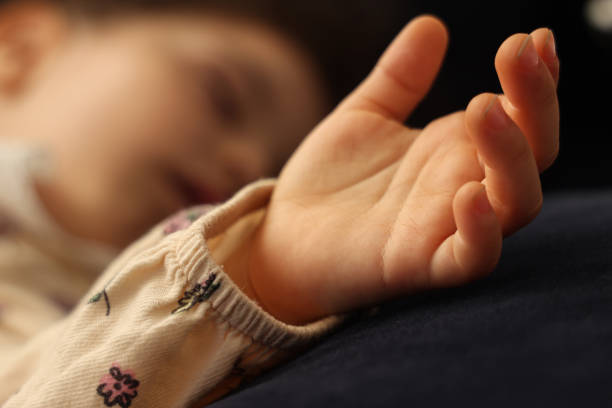 istock Little girl sleeping in her bed 1499859392