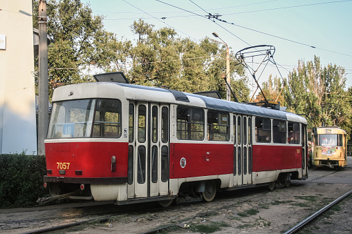Picture of a Tatra T3 tram on display at the depot of Odessa tram i Ukraine. Odesa tram is a tram system, one of the types of public transport in Odesa . The city is served by 19 regular and 5 irregular tram routes. The T3 is a famous type of tramcar produced by Tatra. During its period of production, between 1960 and 1999, 13,991 powered units and 122 unpowered trailers were sold worldwide