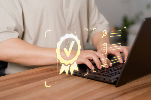 istock Client touching with virtual screen assessment sign of the top service quality assurance certificate for industrial and business. Guarantee, Standard, ISO certification and standardization concept. 1499866511