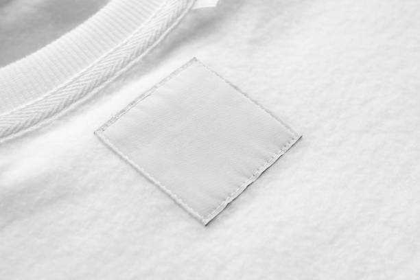 istock Blank white laundry care clothes label on fabric texture background 1499867321