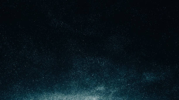 Dust overlay particles texture night sky blue dark Dust overlay. Particles texture. Night sky. Galaxy stars. Blue white glowing flour grain noise on dark black abstract background. salt character stock pictures, royalty-free photos & images