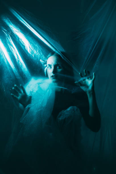 istock Horror fear night terror scared woman trapped dark 1499867645