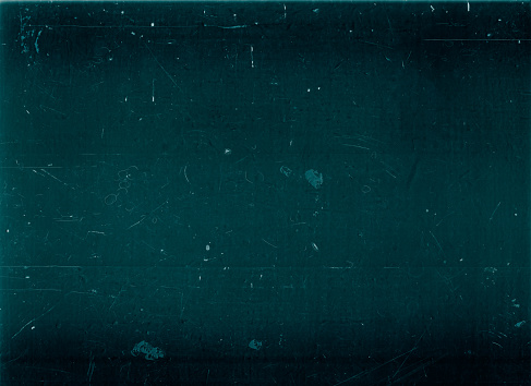Distressed overlay. Dust scratches. Old film noise. Teal blue black dirt stains texture on dark aged grunge surface illustration abstract background.
