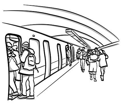 Passengers arrive and depart on the underground subway station.