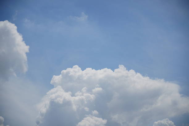 Beautiful blue sky and white fluffy cloud background