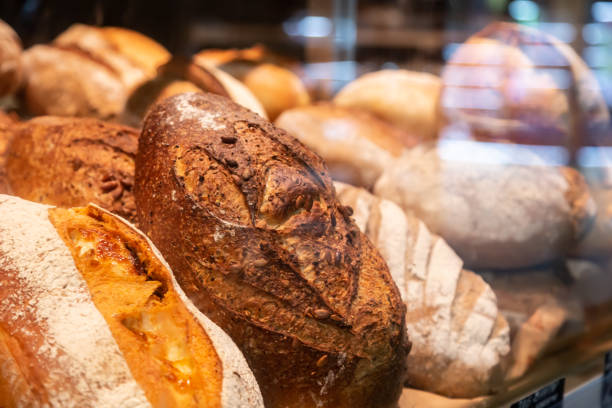 istock Modern bakery Shop with assortment of bread on shelf. 1499877387