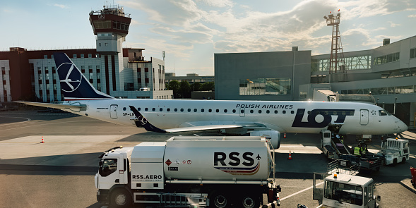 Vilnius, Lithuania, Europe - June 14, 2023: Polish Airlines LOT in Vilnius Airport, Lithuania. Airplain before flight, aero industry of Poland. Good weather, sky, clouds. Aviation concept photography for traveling photo in Europe.