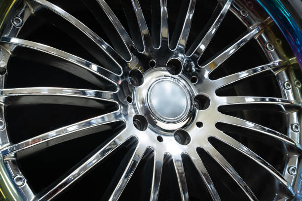 istock Beautiful aluminum die-cast disc wheel with thin chrome spokes for a 20 diameter car close-up on a black background 1499886232