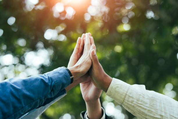 istock High five teamwork is a team together. unity concept Conservation of nature, the environment, groups of people of various nationalities business team success concept together 1499888339