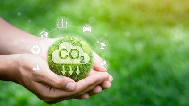 istock reducing carbon emissions carbon neutral concept Net zero emission target, green background with icons. 1499892804