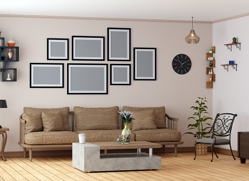 living room interior with wooden fabric sofa next to cofee table, multiple frames on wall, wooden stand, speaker, shelves and plant.