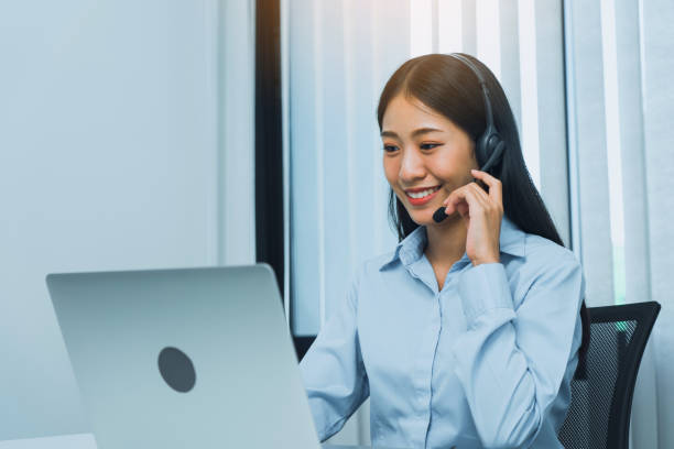 istock Close up call center worker was smiling at his office. 1499905284