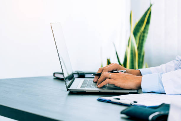 istock Doctor was sitting in the office working on a laptop computer. 1499905298