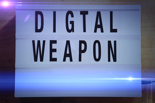 The wording 'Digital Weapon' in a  lightbox sign style. A digital weapon was once perceived to be a malicious software program used in cyberwarfare. These days could we question what is a digital weapon? As 'Mobile Soldiers' are recruited for a cause, they take to social media by storm, shaming and abusing other thought. Is this the modern digital weapon? This is part of my Signs of the Times Collection.