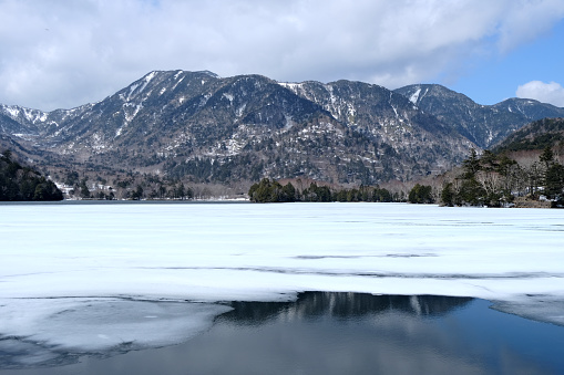 Frozen Yunoko Lake, formed by the eruption of Mt. Mitake. It is about 3 km in circumference and located in the Nikkō National Park in Tochigi Prefecture, Honshū, the main island of Japan.