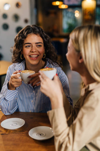 istock female friends on a coffee break in cafeteria 1499915894