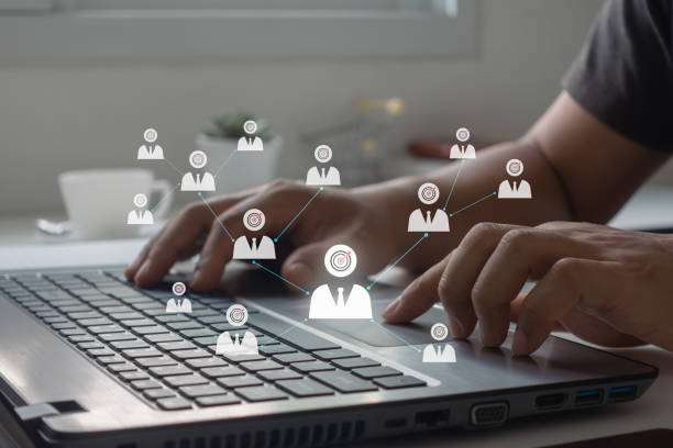 istock Concept of target audience. Businessman presses a button on a laptop computer with Target audience icons. Targeting, Marketing, HR and recruitment. Business, technology and internet concept. 1499917940