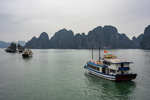 Sun beams on a misty morning on karst mountains and river Li in Guilin/Guangxi region of China