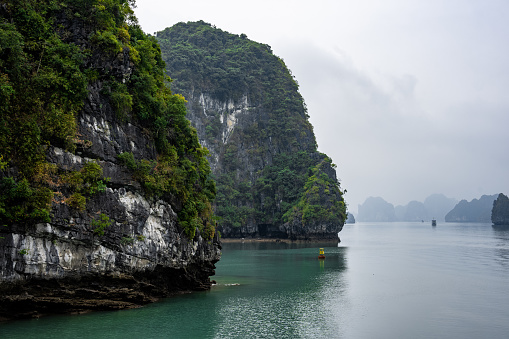 A stunning view of Halong Bay in Vietnam, Southeast Asia with mountains and awe-inspiring cliffs
