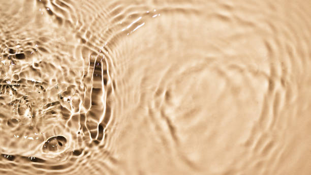 istock Beige water surface background. Water texture with splashes and bubbles for design. 1499922132