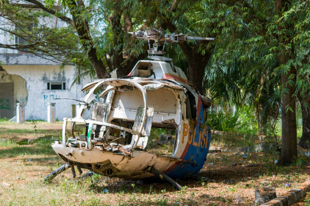 Destroyed helicopter ACEH, INDONESIA - APRIL 25, 2023: destroyed and abandoned Indonesian police helicopter, left behind old building.indonesia police helicopter destroyed by tsunami in 2004 2004 2004 stock pictures, royalty-free photos & images