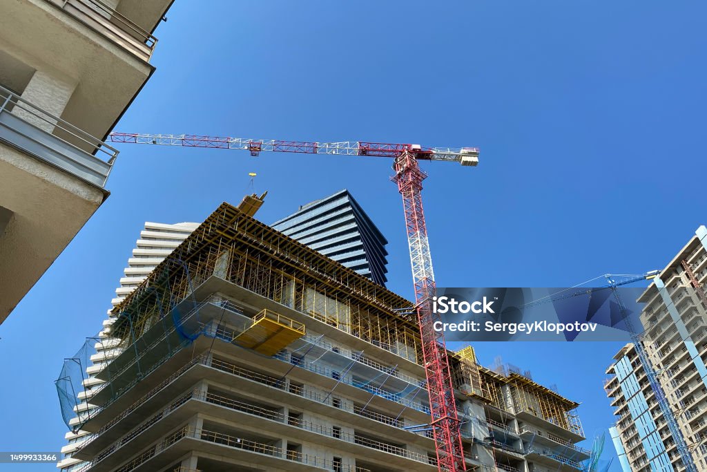 The problem of dense development of modern cities. Bottom view of several beautiful skyscrapers against the sky. The problem of dense development of modern cities. Architecture Stock Photo