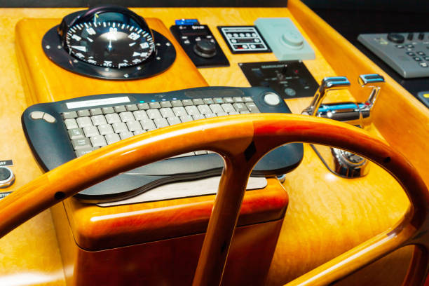 istock Cabin control yacht. Navigation panel with steering wheel and gearshift levers. 1499934889