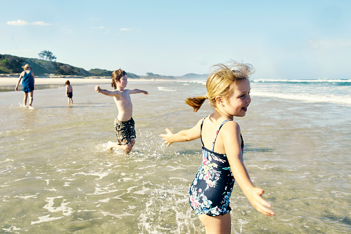 Active Australian Kids Playing on a Beach Holiday