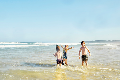 Active Australian Kids Playing on a Beach Holiday