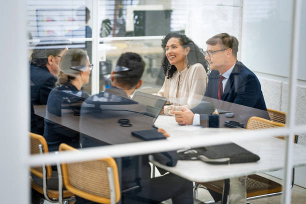 istock Business people talking in boardroom 1499938019