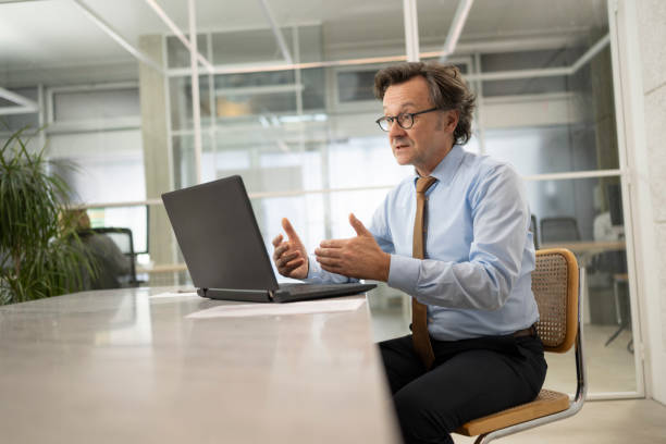 istock Businessman having video call in office 1499938090